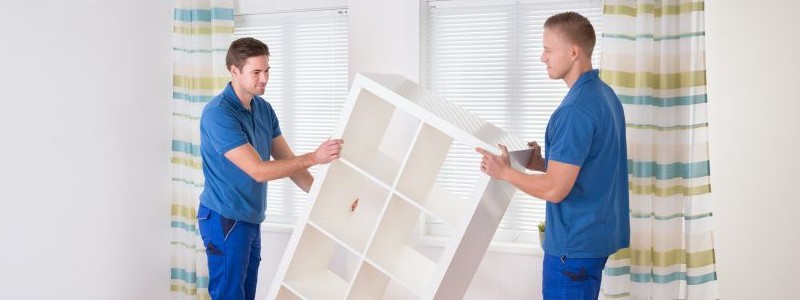 professionals trying to move heavy furniture