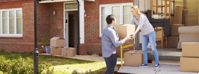 young couple loading household into a truck