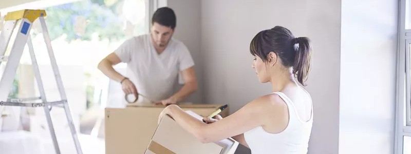 young couple preparing their household for a relocation